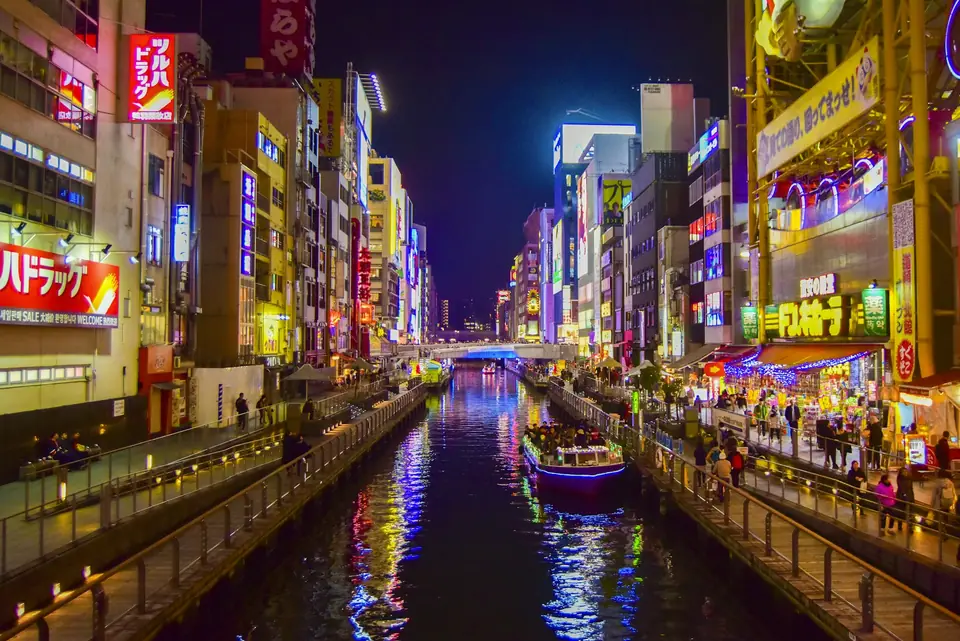 Neon lights reflected in the Dotonbori canal at night